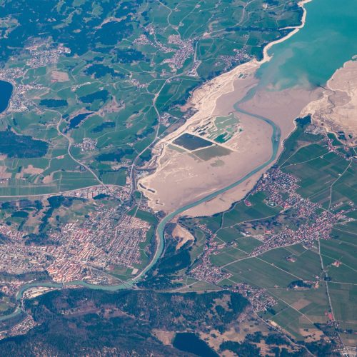 Aerial view of an estuary feeding through a town into a lake